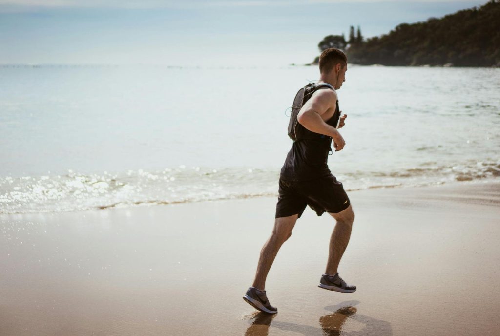 man running on beach