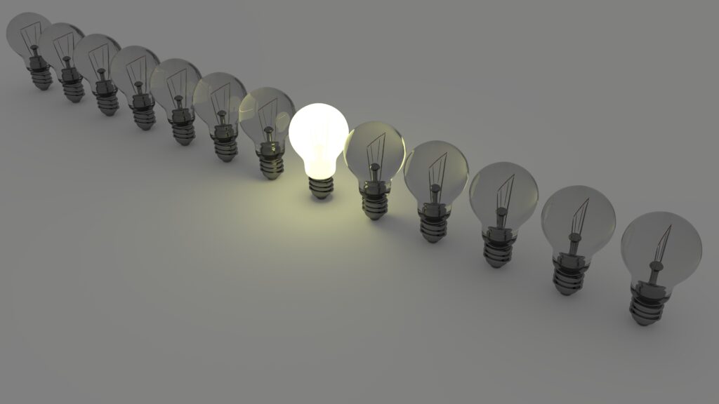 Dim light bulbs lined up with one in the center lit